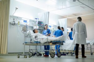 Doctors and nurses attending to patient.