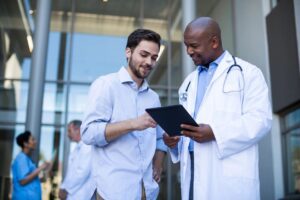 Physician reviewing physical exam results with patient at Monarch Medicine Carmel